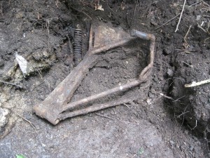 motorcycle frame in mud