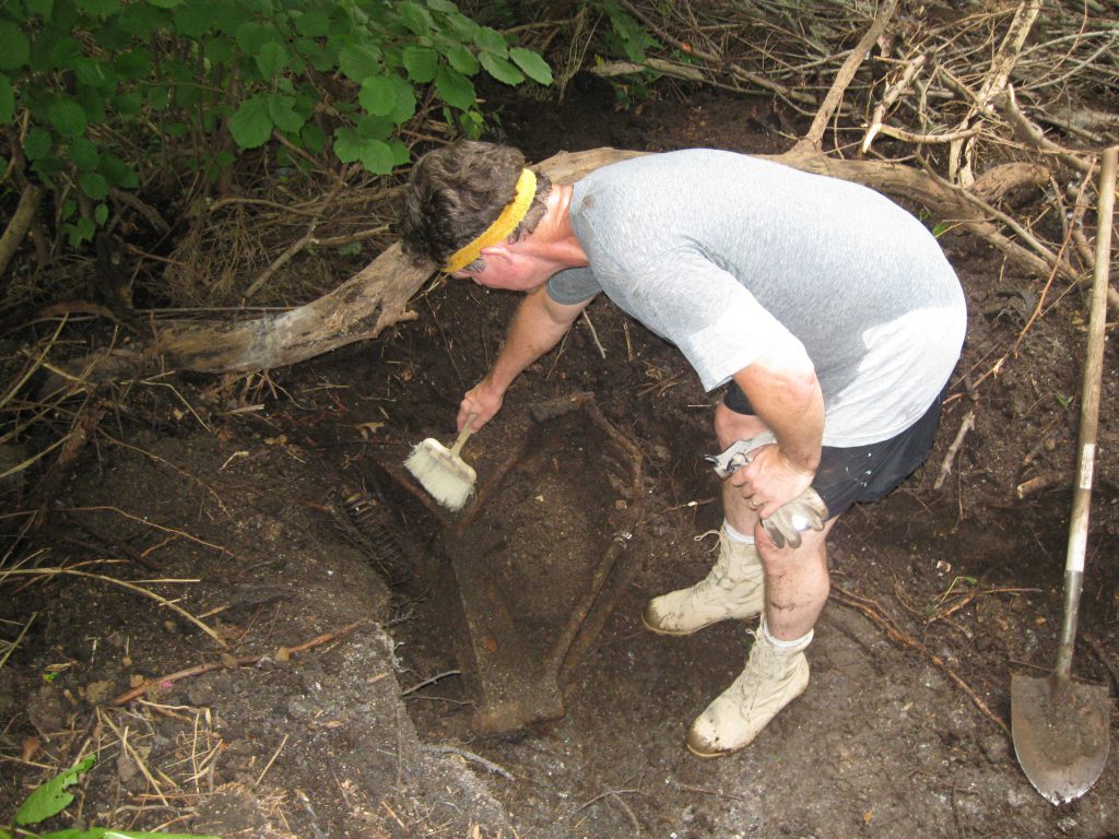 Buried Puch motorcycle frame.